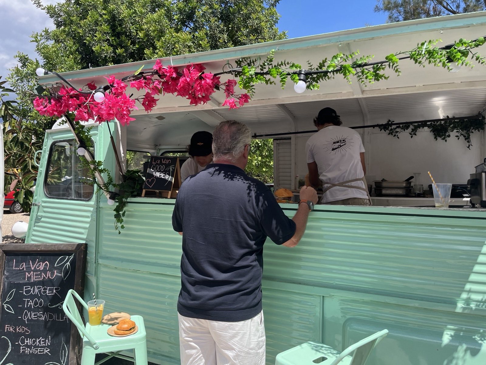 The La Van food truck parked beside a villa pool in Mallorca