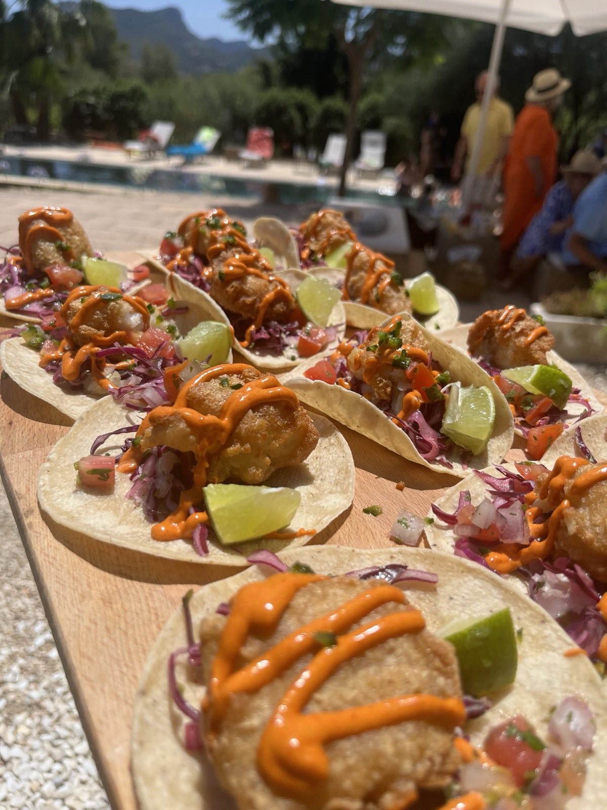 Tray of tacos with lime served at a villa pool party in Mallorca